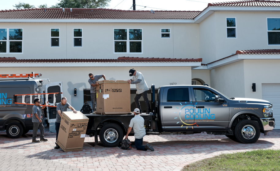 employees unloading AC units