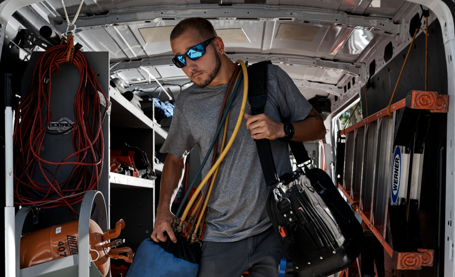 employees unloading AC units